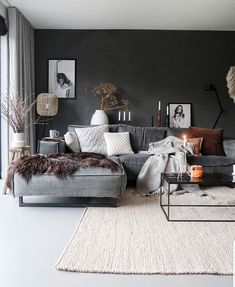 a living room filled with furniture and decor on top of a white carpeted floor