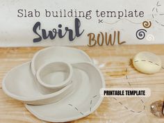 bowls and spoons sitting on top of a wooden table next to a sign that says slab building template swirl bowl