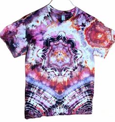 Unique tie dye by ruthies moon.  This is a medium  Gildean cotton tee shirt.  A beautiful  blend of purple,  fushia and bronze used to create my mandala ( front) geode( back) design. I use professional  high quality fiber reactive procion dye by Dharma. All shirts are pre washed  and treated post dye so colors won't  bleed or fade. Wash separately  the first few washes.  Custom orders are welcome with a choice  of over 50 colors  to make your shirt uniquely  yours. Pink Cotton Festival T-shirt, Pink Cotton T-shirt For Festivals, Pink Short Sleeve T-shirt For Festivals, Hand Dyed Acid Wash T-shirt For Festivals, Bohemian Hand Dyed Crew Neck T-shirt, Hippie Hand Dyed Tie Dye T-shirt, Hippie Hand Dyed Festival T-shirt, Hippie Hand-dyed Festival T-shirt, Festival Hippie Hand Dyed T-shirt