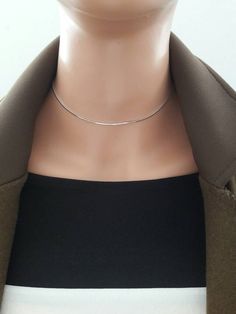 "Handmade by Eriko Design Studio in Brooklyn, NY Delicate silver snake chain choker necklace- basic yet stylish: it can be layered with other chokers or necklaces. -------------------- DETAILS ・high quality 1 mm rhodium plated square snake chain ------------------- SIZE ・Available in 4 sizes 12-14\"(12 inches + adjustable 2 inch extender) 14-16\"(14 inches + adjustable 2 inch extender) 16-18\"(16 inches + adjustable 2 inch extender) 18-20\"(18 inches + adjustable 2 inch extender) ・It closes with Rose Gold Choker Necklace, Minimal Choker, Choker Silver, Gold Snake Chain, Dainty Choker, Layered Necklaces Silver, Silver Choker, Silver Snake Chain, Plastic Jewelry