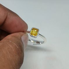 BAND - ROUNAK JEWELLERS MATERIAL - 925 STERLING SILVER GEMSTONE - 100% NATURAL YELLOW SAPPHIRE YELLOW SAPPHIRE STONE WEIGHT - 1.45 CARAT YELLOW SAPPHIRE STONE SIZE - 5.40 X 6.50 MM GROSS WEIGHT - 2.760 GM STONE SHAPE - EMERALD GEM COLOUR - YELLOW RING SIZE - ALL SIZE AVAILABLE PLEASE GIVE YOUR OPENION OR FEEDBACK ABOUT THE PRODUCT. WE ACCEPT BULK ORDER ALSO. https://www.etsy.com/in-en/shop/RounakJewellers?ref=search_shop_redirect Yellow Sterling Silver Birthstone Ring, Yellow Birthstone Ring In Sterling Silver, Adjustable Sterling Silver Yellow Ring, Adjustable Yellow Sterling Silver Rings, Yellow Birthstone Rings For Gifts, Yellow Sterling Silver Rings For Anniversary, Birthday Sterling Silver Rings Stamped 925, Yellow 925 Stamped Rings As A Gift, Yellow Rings Stamped 925 For Gift