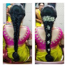 the back of a woman's head with braids and flowers in her hair