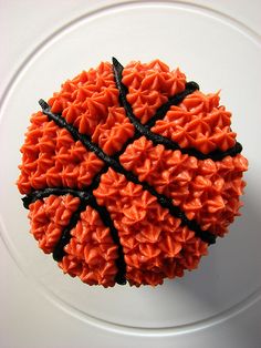 a cupcake made to look like a basketball