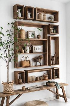 a wooden shelf filled with lots of shelves and baskets on top of it's sides