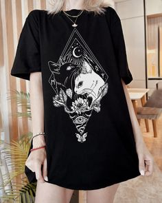 ☾ Black and White Cats Yin Yang Tshirt - with Moon, Stars, Evil Eye hand-drawn design by ClariS - https://www.instagram.com/susanclari ☾ This witchy classic unisex shirt fits like a well-loved favorite! Enjoy a vivid print along with the soft garment feel  🖤Soft cotton and quality print We use the latest and greatest technology for printing. Brightest colors and high durability achieved by printing with professional Direct-to-garment with eco-friendly water-based inks. 🖤Ribbed knit collars to bolster shaping 🖤Dual side seams 🖤Runs true to size (unisex) 🎁 Perfect Gift for you and your loved ones :) Let`s be friends :) follow instagram.com/medoro.design *100% Airlume combed and ringspun cotton (fiber content may vary for different colors) * Light fabric 4.2 oz/yd² (142 g/m²) ⪼Check out Celestial Goth, Plus Size Goth Clothes, Witchy Shirts, Egirl Clothing, Witchy Graphic Print Crew Neck Tops, Goth Plus Size, White Cotton T-shirt With Moon Print, Black And White Cats, Trendy White T-shirt With Cat Print