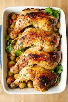 chicken and potatoes in a white casserole dish