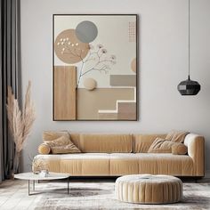 a living room with a couch, coffee table and art on the wall above it