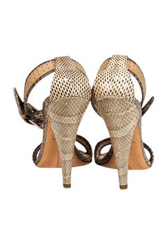 Get tropical in these snake skin heels from Oscar De La Renta! Made with high quality materials, these smart ankle strap sandals are the perfect shoe to wear when you want to soak up the sun! Pair them with your favorite sun dress from Summer, or your best bodycon for Winter! US Size 5, EU Size 35 Made in Italy Snakeskin upper Ankle wrap with silver-toned buckle Leather footbed with no signs of wear Leather sole with minimal wear Heel 4.5" Spring Ankle Strap Heels With Snake Print, Summer Open Toe Sandals With Snake Print, Leather Snake Print Open Toe Sandals, Leather Open Toe Sandals With Snake Print, Define Feminine, Snake Skin Heels, Soak Up The Sun, Buy Shoes Online, Sun Dress