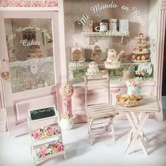 a doll house with pink furniture and decorations