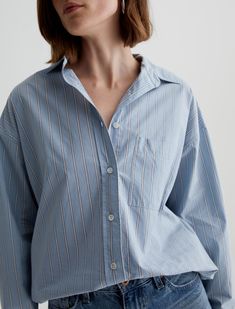 An all-seasons addition to any wardrobe, the Brea Shirt nods to menswear with its oversized fit and classic details. It's cut for an oversized fit in cotton poplin with a timeless stripe pattern and features a pointed collar, long sleeves, and a single patch pocket at the chest. Button it all the way up for work meetings, and then leave it undone over your favorite T-shirt on the weekends.Essential Cotton Poplin, 100% Cotton Work Meetings, Work Meeting, Stripe Long Sleeve, Ag Jeans, All The Way Up, Oversized Shirt, Relaxed Style, Striped Long Sleeve, Cotton Poplin