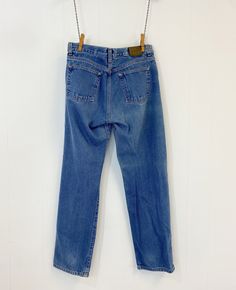 "Vintage Calvin Klein jeans featuring; ~ mid rise traditional 5 pocket styling zip fly with single button at the waist leather tag marked \"Calvin Klein Jeans\" on the front coin pocket leather label on back at waist marked \" Calvin Klein Jeans\" straight or stovepipe leg ~ of a heavy weight, 100% cotton denim in a medium blue wash ~ labeled \"Calvin Klein Jeans\", tag says these are a dark stone wash but they do show some fade, they are tagged a women's size 7 /8, measurements when laid out fl Classic Tapered Leg Jeans With Button Zip Fly, Classic Medium Wash Jeans With Zip Fly, Classic Medium Wash Jeans, Vintage Calvin Klein Jeans, Straight Leg Blue Jeans, Vintage Calvin Klein, Leather Tag, Leather Label, Calvin Klein Jeans