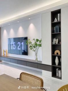 a large flat screen tv mounted to the side of a wall in a living room