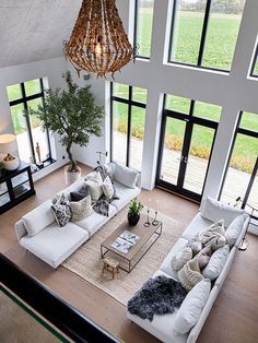 an aerial view of a living room with large windows