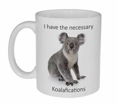 a coffee mug with an image of a koala bear on it's side