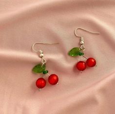 Handmade cherry earrings. Available in your choice of metal colour. Hook back design fits comfortably and securely without additional backing. Cherry Dangle Earrings With Ear Wire, Nickel Free Cherry Earrings For Gift, Nickel Free Cherry Colored Earrings For Gift, Handmade Trendy Cherry Earrings, Trendy Handmade Cherry Earrings, Cherry Round Earrings For Gift, Nickel-free Cherry Colored Earrings For Gift, Cherry Colored Round Earrings For Gift, Trendy Handmade Cherry Colored Earrings