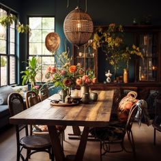 a dining room table with flowers in vases on it and chairs around the table