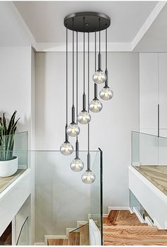 a modern chandelier hanging from the ceiling