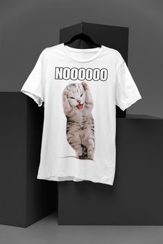 Unleash the drama queen in you with our latest collection! Presenting the "Dramatic Kitty Meme T-Shirt" - where fashion meets fun. Featuring the internet's most beloved dramatic kitty, this t-shirt isn't just a piece of clothing; it's a statement. Perfect for casual outings, meme-themed parties, or just lounging around, let your style do the talking. Grab yours now and be the center of attention wherever you go! 5.3-ounce, 100% cotton (99/1 cotton/poly (Ash) & 90/10 cotton/poly (Sport Grey), 50/ Funny White T-shirt With Cat Design, Funny White Top With Cat Design, Drama Queen, Meme Tshirts, Drama Queens, The Drama, Piece Of Clothing, Party Themes, Ash