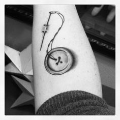 a black and white photo of a person's arm with a clock on it