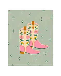 a pair of pink boots with flowers on them are shown in front of a green background