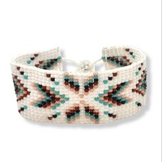 Lovely handmade Huichol beaded bracelet, southwest style,  arrowhead pattern, white, turquoise and brown multi colour, from our Fair Trade partners in Mexico.  Size is approx. between 18.5long cm by 2.5 cm wide. Please also visit my new shop, BALI COCONUT BY ROSA made in Fairtrade partnership with fine Balinese artisans and featuring all natural jewellery: https://www.etsy.com/uk/shop/BaliCoconutbyRosa Spend over $35 US Dollars with us and receive FREE postage for orders to the USA. Arrowhead Pattern, Arrowhead Bracelet, Bali Coconut, Arrowheads Design, Turquoise Colour, Bead Loom Bracelets, Bead Loom, Loom Bracelets, Handcrafted Artisan Jewelry