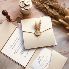 two envelopes and some coins on a table