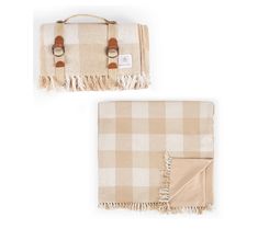 two tan and white plaid blankets with brown leather handles