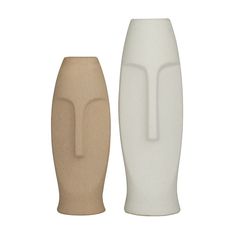 two white and brown vases sitting next to each other