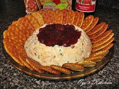 a platter filled with crackers and dip