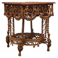 an ornate wooden table with intricate carvings on it