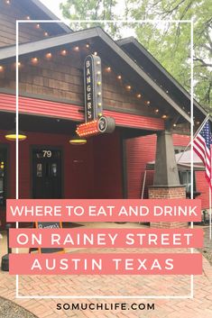 a red building with the words where to eat and drink on it in front of an american flag