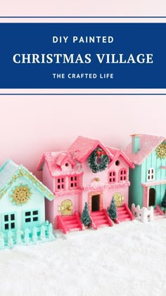 a pink and blue christmas village with the words diy painted christmas village