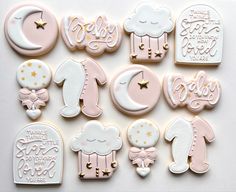 decorated cookies are arranged in the shape of baby's first birthdays and names