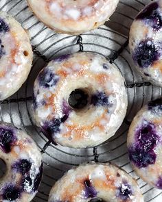 blueberry donuts cooling on a wire rack