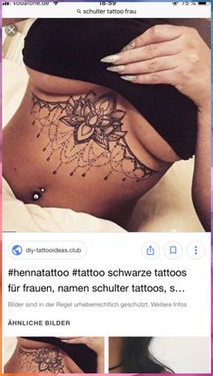 a woman laying on top of a bed with tattoos on her stomach and the words underbob tattoo