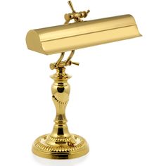 a gold desk lamp on a white background with clippings to the top and bottom