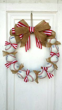 a baseball wreath with burlocks and bows on the front door is displayed in an instagram