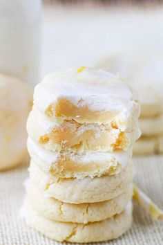 soft lemon cream cheese cookies stacked on top of each other