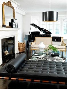 a living room filled with furniture and a piano