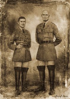 two men in uniforms standing next to each other