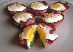 an assortment of food items on a plate with one egg and the other half eaten