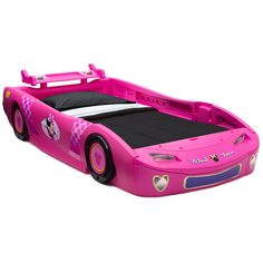 a pink bed with mickey mouse on the top and bottom wheels, in front of a white background