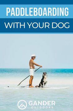 a man on a surfboard with his dog