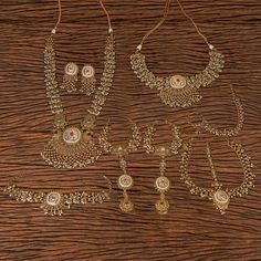 A stunning bridal set perfect to make your wedding day even more special! This set includes a pair of earrings, choker necklace,Long Necklace, maathapatti, 2 pieces haathphool , Bajuband and a nath. ZohraArts Gold-Plated Indian Jewelry Polki Choker Set with Necklace and Earrings. Indian Bridal Traditional Jewelry Sets. All jewelry features high quality electroplating that does not fade or chip and is nickel free (hypoallergenic). Orders are shipped via USPS with tracking and confirmation. Item a Traditional Festive Sets For Marriage, Gold Sets With Pallu For Marriage, Kundan Bridal Sets For Marriage, Wedding Bridal Sets In Temple Jewelry Style, Traditional Bridal Sets With Tilla For Marriage, Traditional Kundan Bridal Sets For Marriage, White Hand Set Temple Jewelry Sets, White Temple Jewelry Sets Hand Set, Silver Bridal Sets With Pallu For Wedding