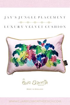 a pink pillow with colorful flowers on it and the words, jay's jungle placement luxury