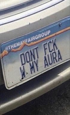 there is a car license plate that says don't f k my aura