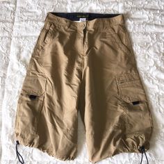 Tan Cargo Hiking Shorts. Drawstring Legs Large Cargo Side Pockets. Belted Waist. Waist Measures 15 "Across. 23" Length. Baggy Cargo Shorts, Knee Shorts, Khaki Cargo Shorts, Tan Shorts, Cargo Khaki, Hiking Shorts, Group 1, Shorts Cargo, Khaki Shorts