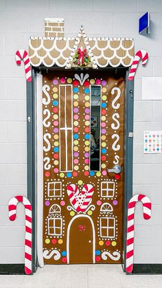 a gingerbread house door decorated with candy canes