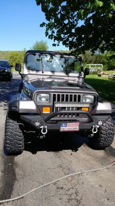 a jeep is parked on the side of the road