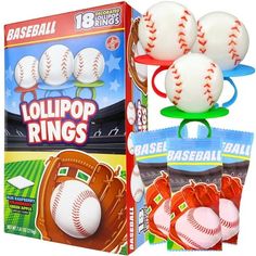 four baseball rings are in front of a box with three balls on it, and one is